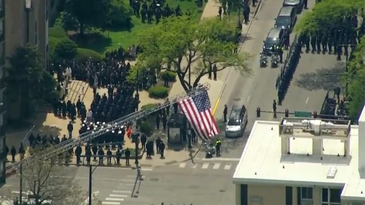 Police officers standing in formation during a funeral ceremony