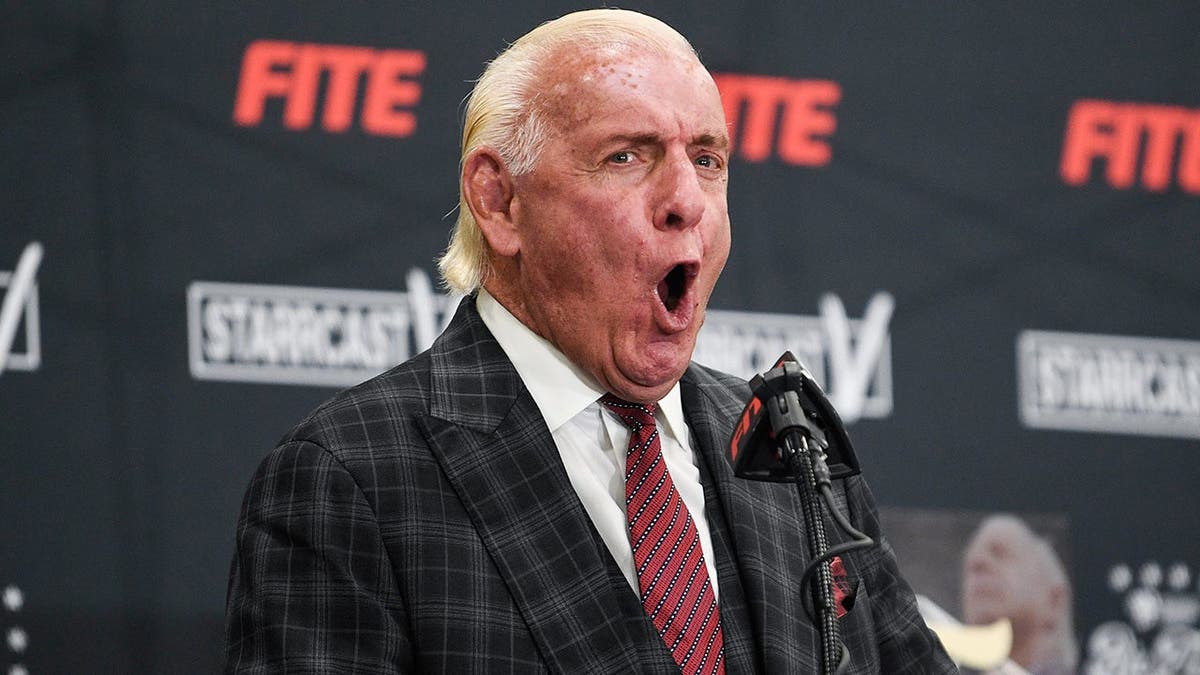 Ric Flair exclaiming his trademark 'WOOO' at a press conference in Nashville, Tenn.