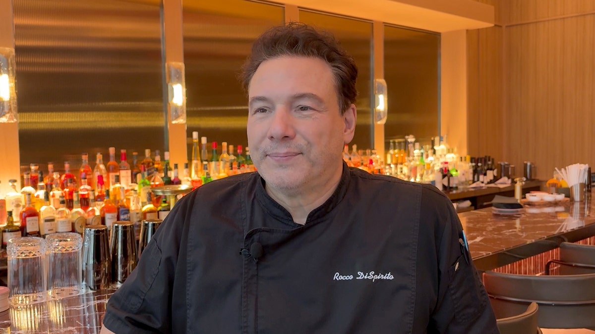 Celebrity chef Rocco DiSpirito sits in front of the bar at his restaurant Bar Rocco.