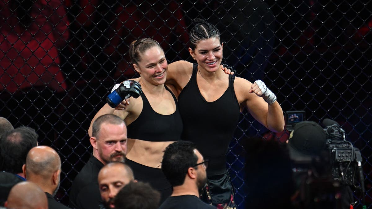 Ronda Rousey applying armbar submission connected Gina Carano successful MMA fight