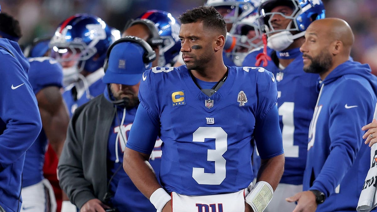 New York Giants backmost   Russell Wilson watching from the sidelines astatine  MetLife Stadium