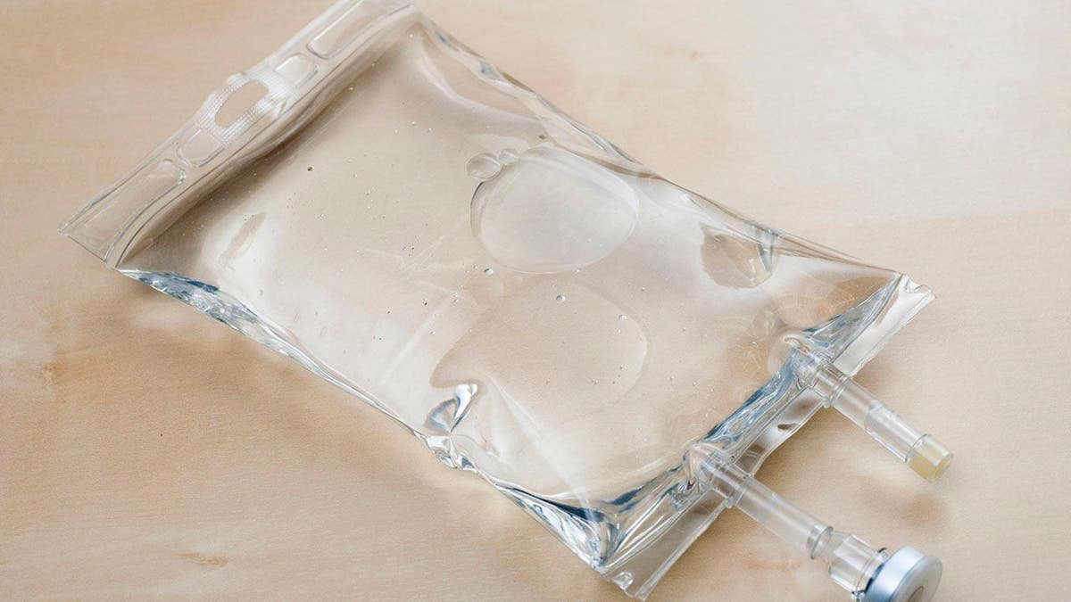 Saline bag resting on a table surface