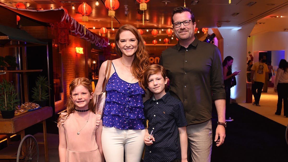 Sarah Drew with husband Peter Lanfer and children Micah and Hannah at Minions premiere in Los Angeles