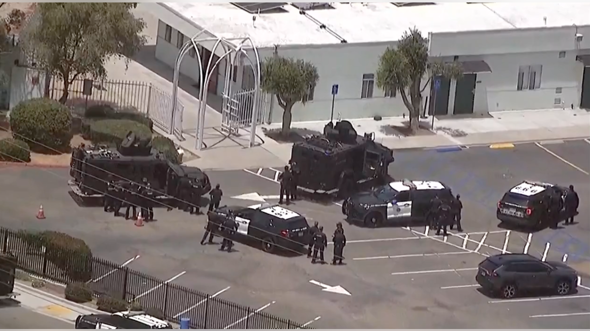 Aerial view of police officers, SWAT vehicles and emergency response units outside the Islamic Center of San Diego.