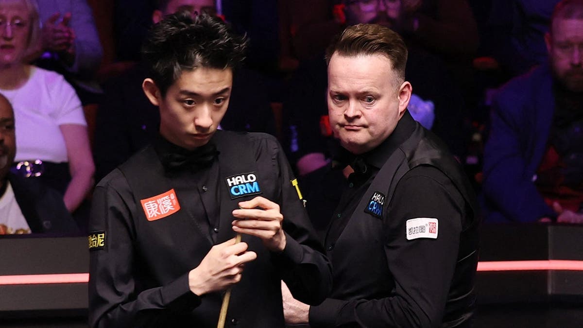 England's Shaun Murphy and China's Wu Yize playing snooker at The Crucible Theatre in Sheffield