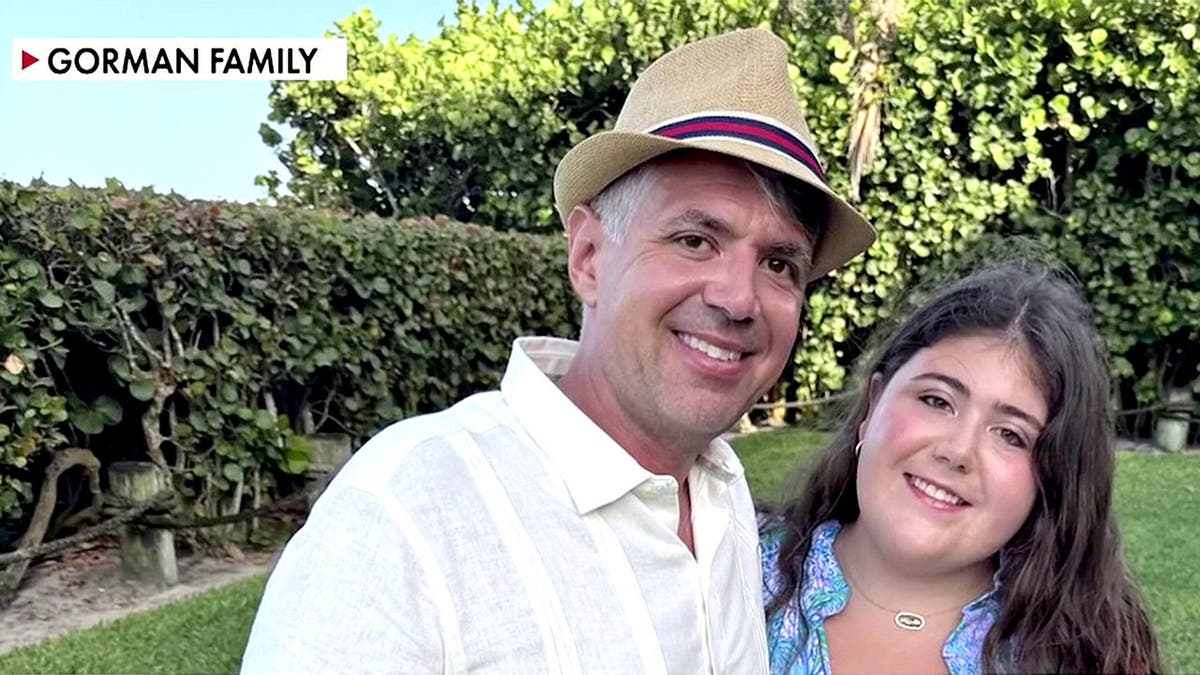 Sheridan Gorman poses with her father Tom Gorman in family photo.