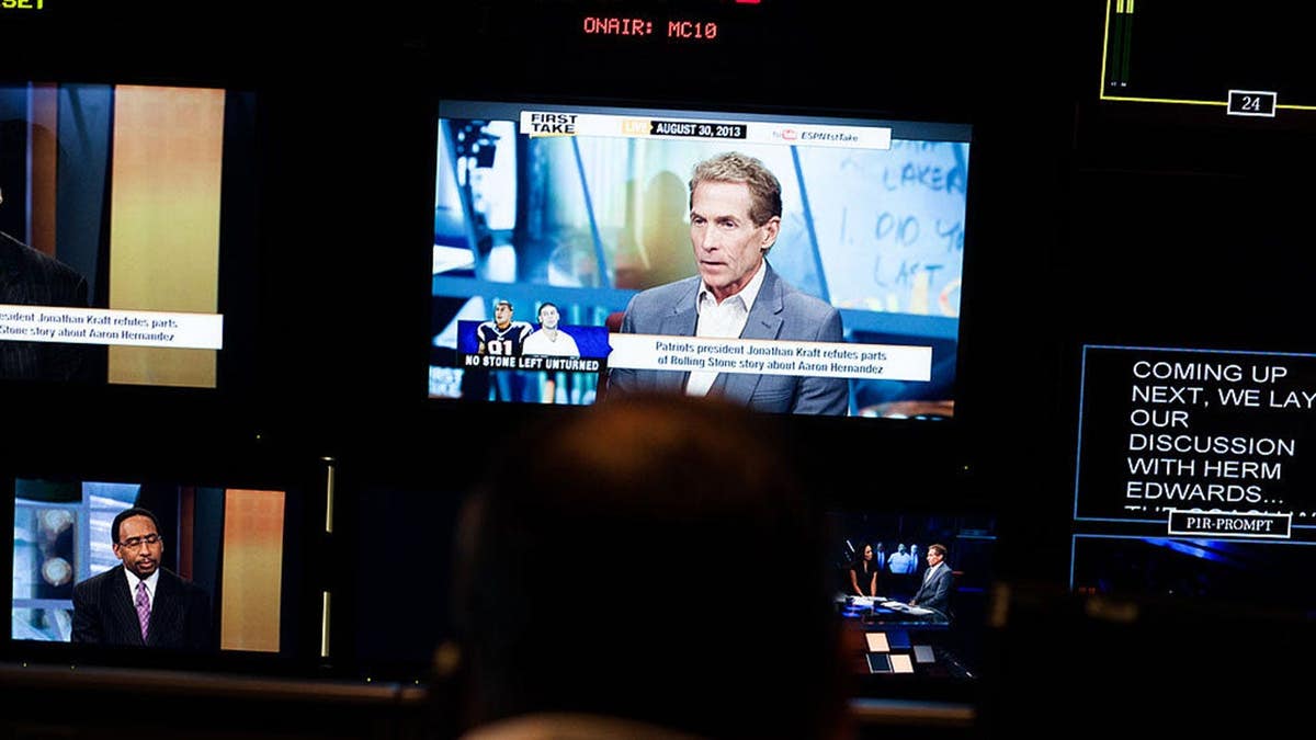 Skip Bayless appears on television screens in ESPN control room during live filming