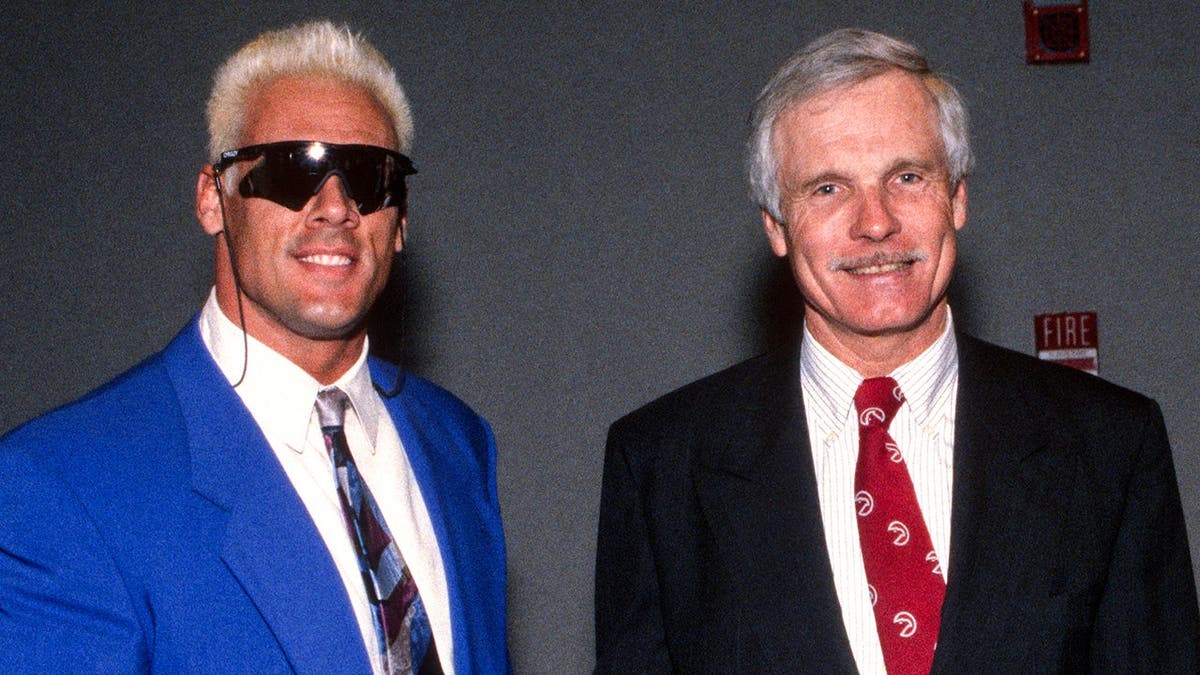 Sting and Ted Turner shaking hands in Atlanta, Georgia