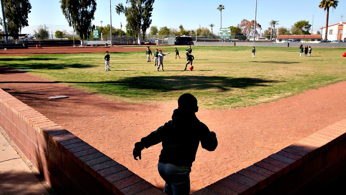 Students playing ball during recess at St. Agnes Elementary School in Phoenix