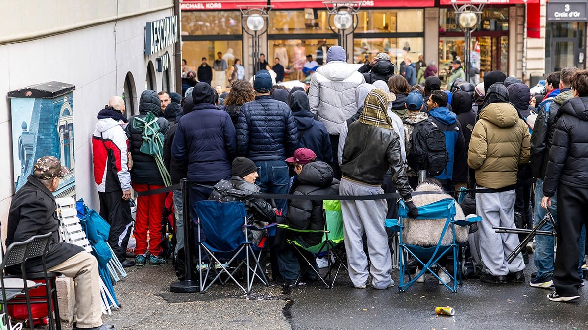 Customers queuing outside a store to buy the new Royal Pop watch in Geneva