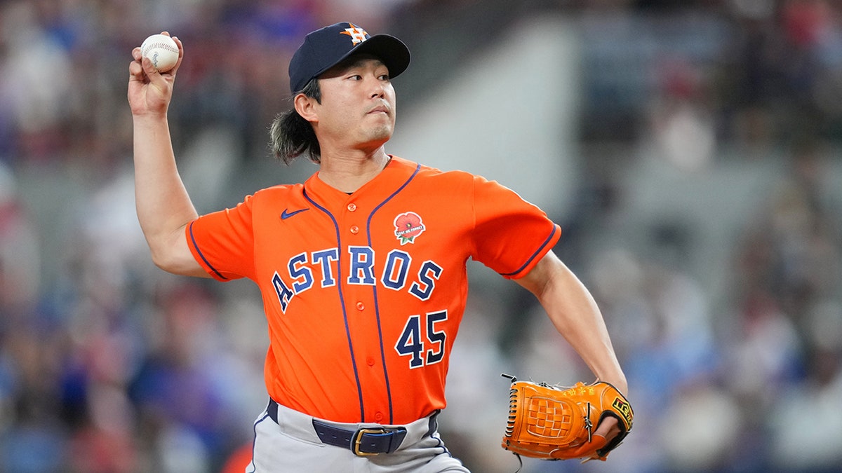 Tatsuya Imai throws a pitch