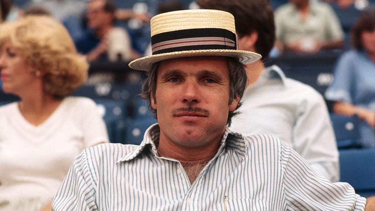 Ted Turner standing and smiling