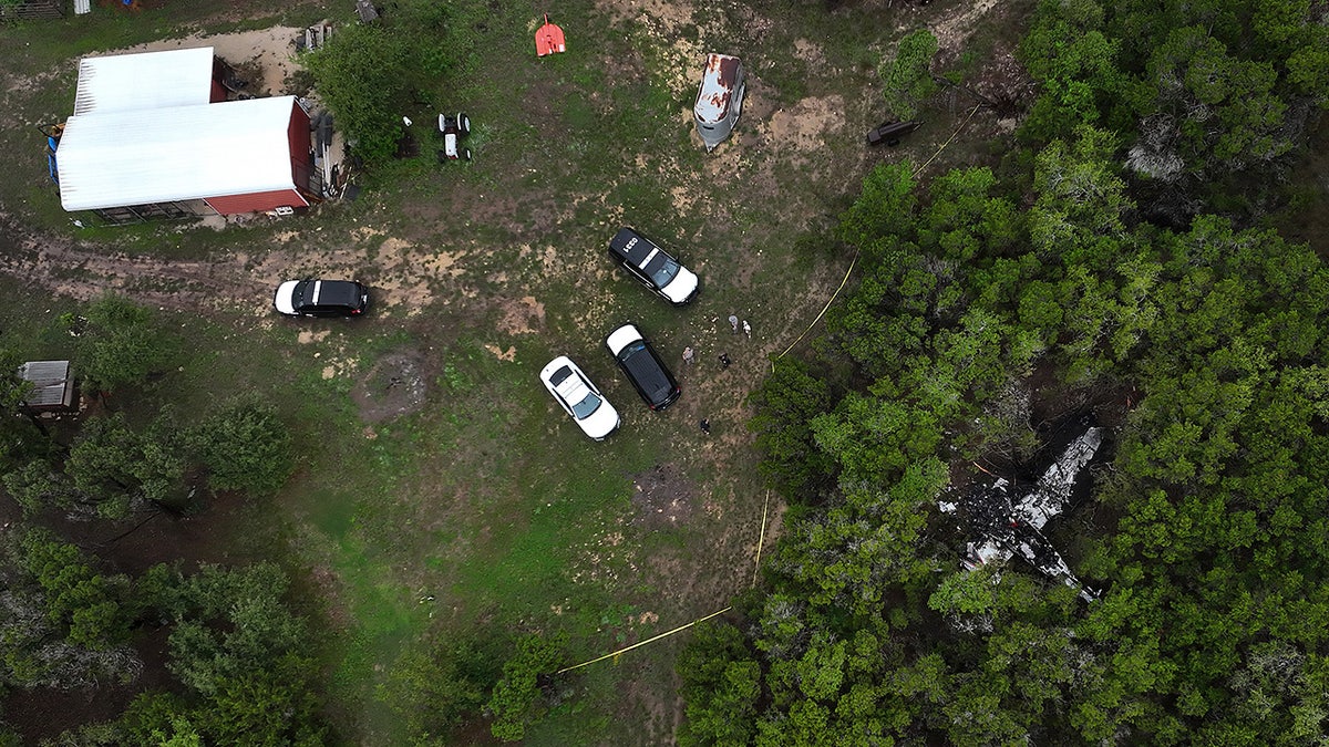 A crashed Cessna airplane is seen in a wooded area on Round Rock Road in Wimberley, Texas,