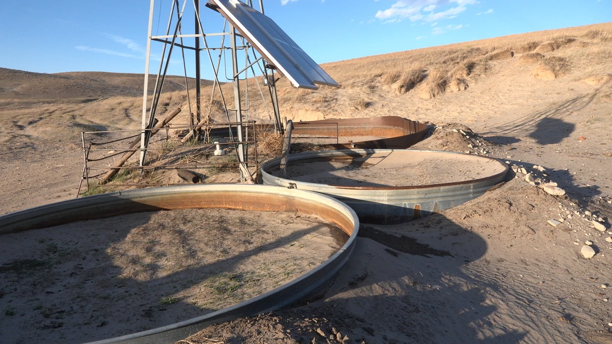 Livestock watering tanks filled with sand