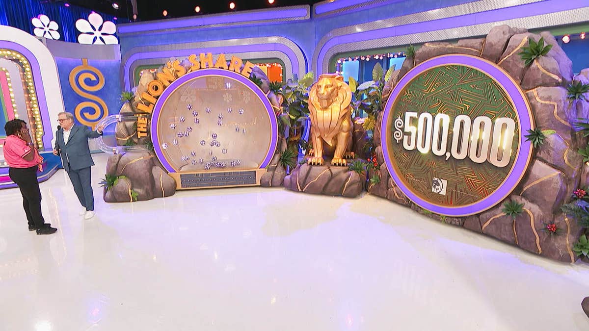 Vanesa and Drew Carey standing on the set of The Price Is Right