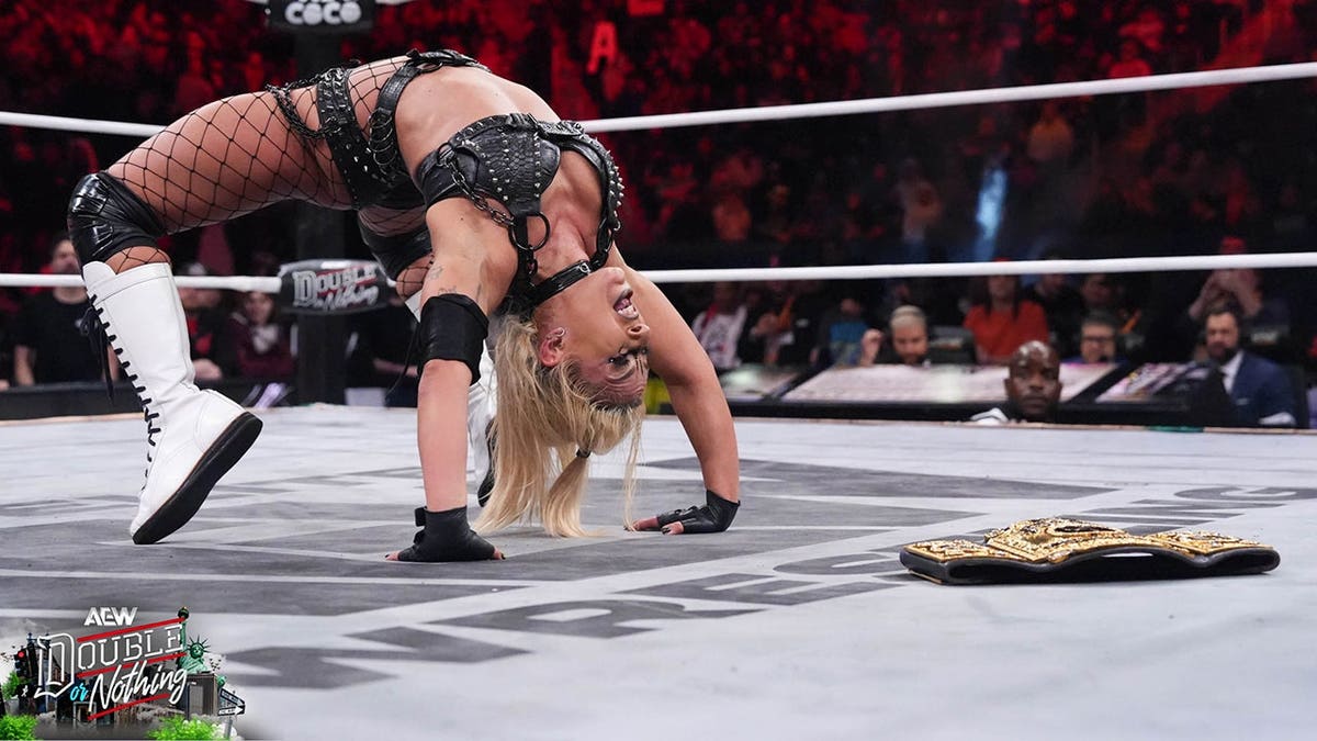 Thekla poses in a wrestling ring at AEW Double or Nothing event in Queens, New York