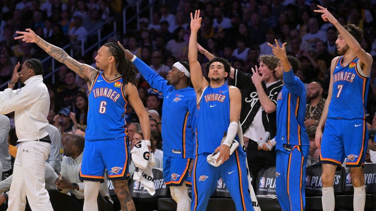 The Oklahoma City Thunder bench reacts after making a 3-pointer vs. the Los Angeles Lakers in the second round of the 2026 NBA Playoffs at Crypto.com Arena.