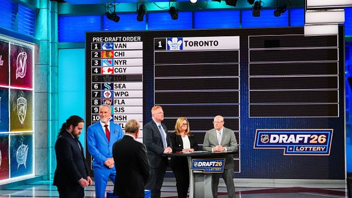 Toronto Maple Leafs players celebrating winning first overall pick at NHL Draft Lottery in Secaucus New Jersey