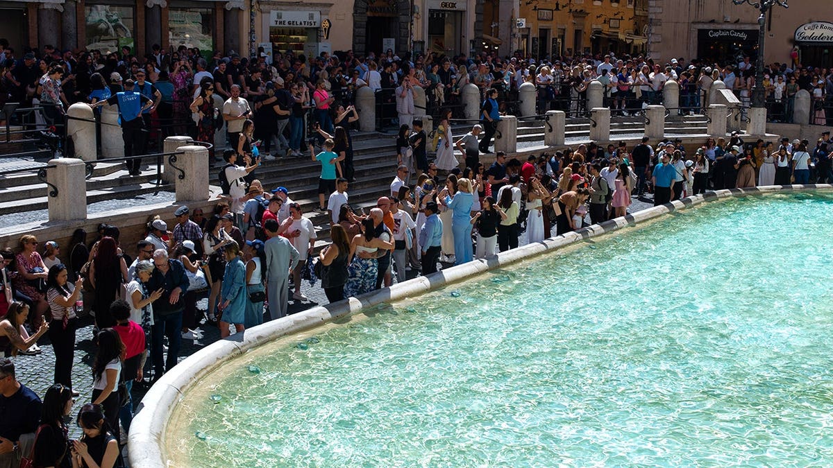 Tourists visiting the Trevi Fountain in Rome, Italy