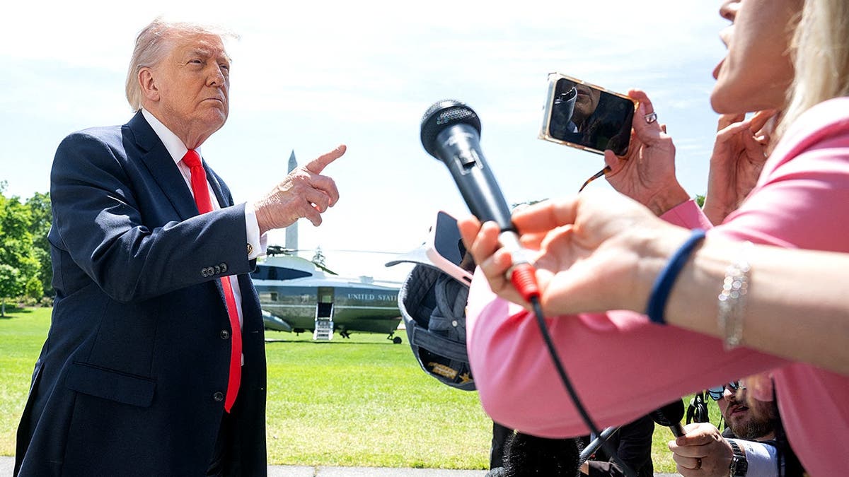 Trump speaks to reporters on South Lawn before departing for Florida.