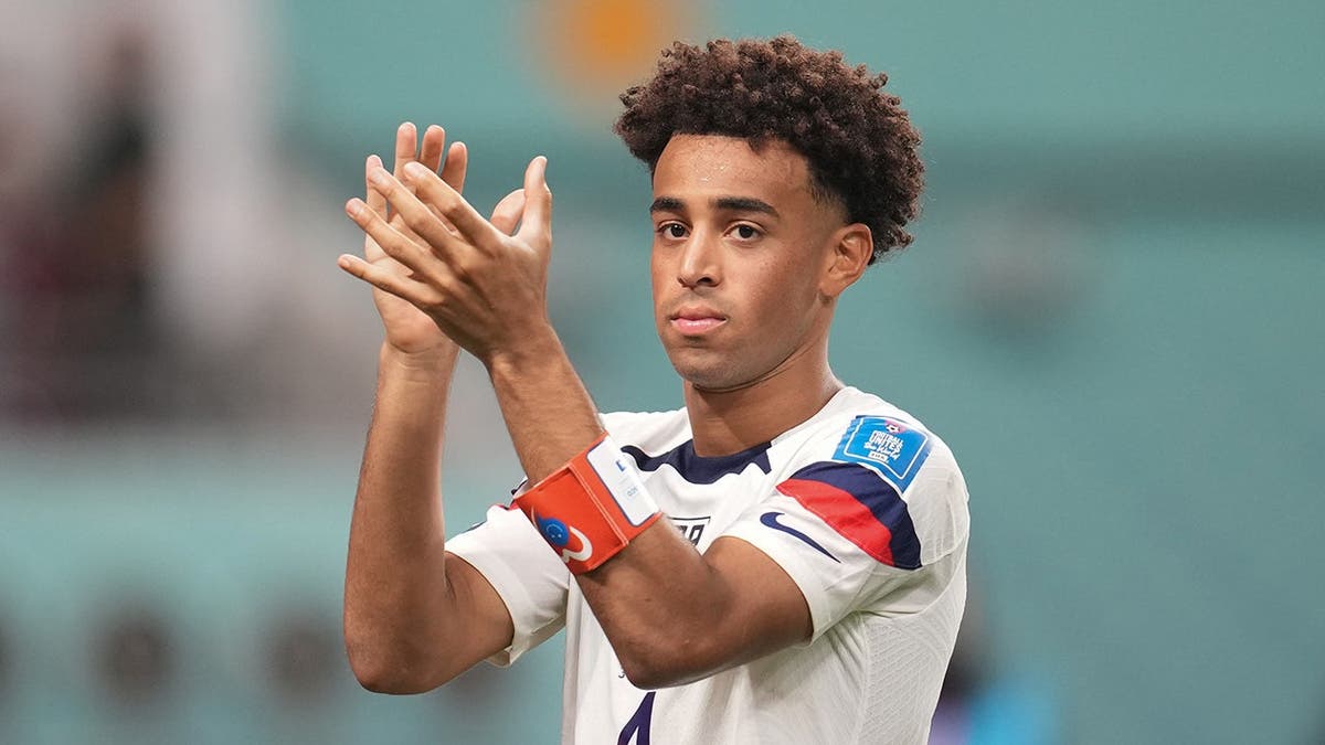 Tyler Adams saluting fans astatine  Khalifa International Stadium successful  Doha