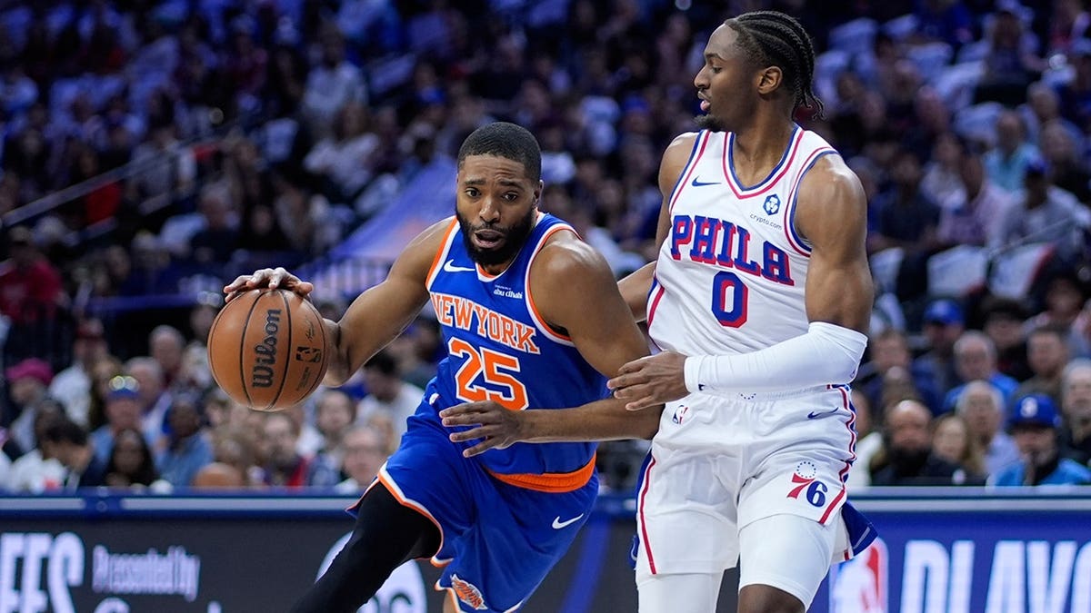 Tyrese Maxey defending Mikal Bridges during NBA playoff game in Philadelphia
