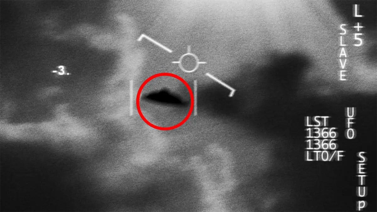 Satellite image showing a UFO spaceship at night with FBI investigation markings