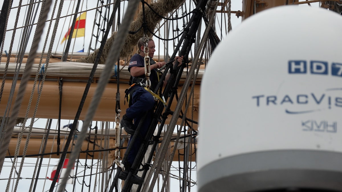 A crew member climbs the rigging aboard the USCGC Eagle during Sail 250 in New Orleans.