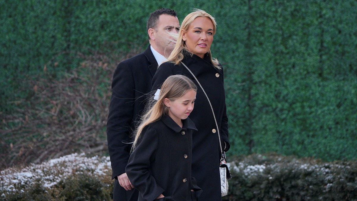 Vanessa Trump walking outside St. John's Church wearing a coat