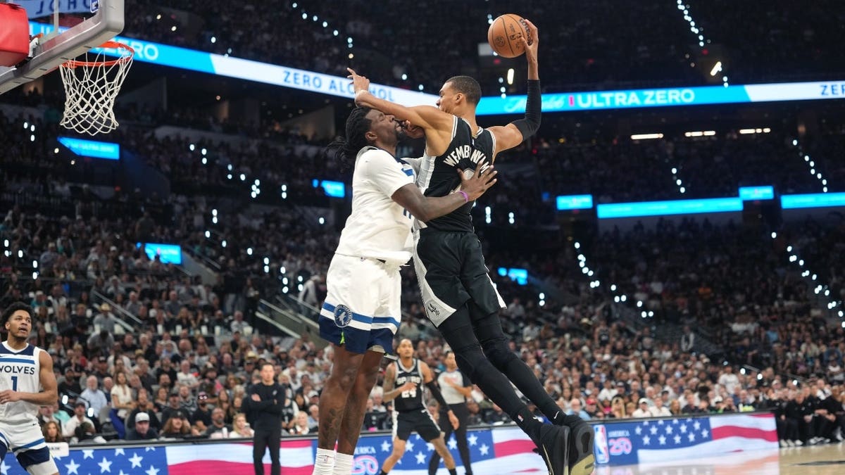 San Antonio Spurs big Victor Wembanyama attacks the rim against Minnesota Timberwolves PF Naz Reid during Game 5 of their second-round seriesd in the 2026 NBA Playoffs at Frost Bank Center in Texas.