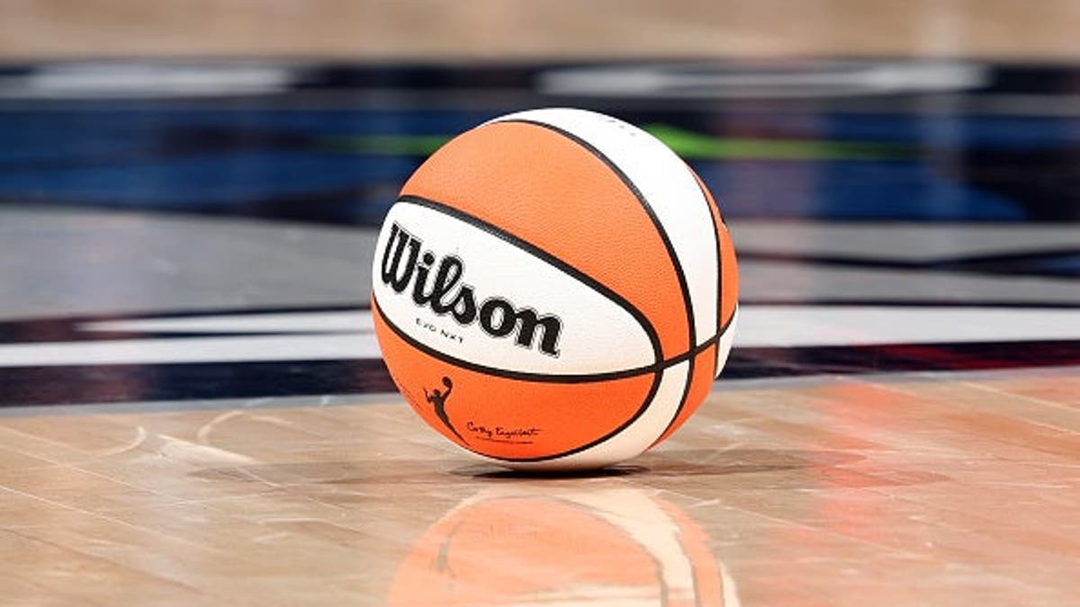 Official Wilson basketball resting on a basketball court at Target Center in Minneapolis