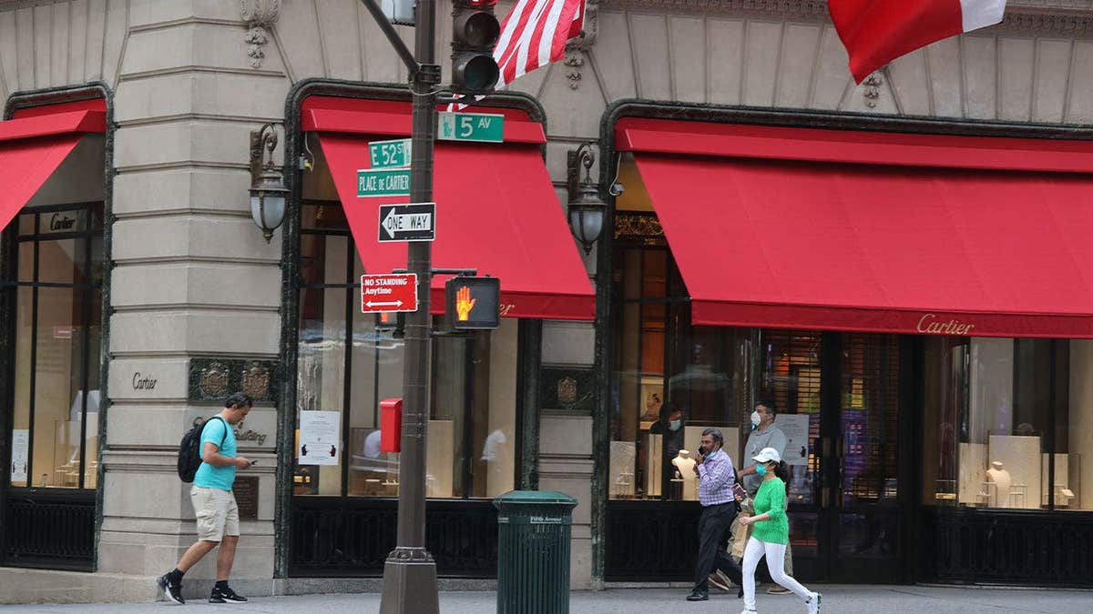 People locomotion adjacent the Cartier store connected Fifth Avenue arsenic New York City