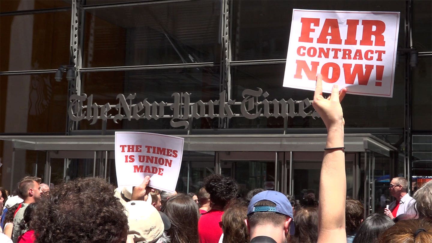 New York Times staffers rally outside headquarters demanding fair contract and AI protections