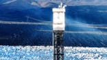 Ivanpah solar power tower surrounded by mirrors in California desert