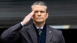 U.S. Secretary of War Pete Hegseth salutes