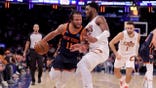 New York Knicks PG Jalen Brunson controls the ball vs. Cleveland Cavaliers SG Donovan Mitchell at Madison Square Garden.