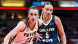 Indiana Fever guard Caitlin Clark and Dallas Wings guard Paige Bueckers during an inbounds play at Gainbridge Fieldhouse