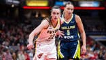 Indiana Fever guard Caitlin Clark and Dallas Wings guard Paige Bueckers during basketball game in Indianapolis