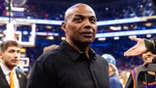 Charles Barkley standing courtside at an NBA Cup game in Phoenix