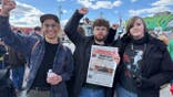 Protesters holding Communist newspaper at Minneapolis May Day rally
