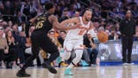 New York Knicks guard Jalen Brunson dribbling against Cleveland Cavaliers guard Donovan Mitchell at Madison Square Garden