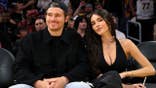 Quarterback Justin Herbert and Madison Beer attending a basketball game at Crypto.com Arena