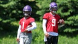 Kyler Murray and J.J. McCarthy standing during an OTA workout in Eagan Minnesota