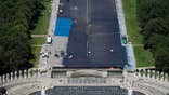 Workers applying blue protective coating to Lincoln Memorial Reflecting Pool in Washington