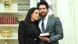 Tulsi Gabbard embraces husband Abraham Williams after swearing-in ceremony.