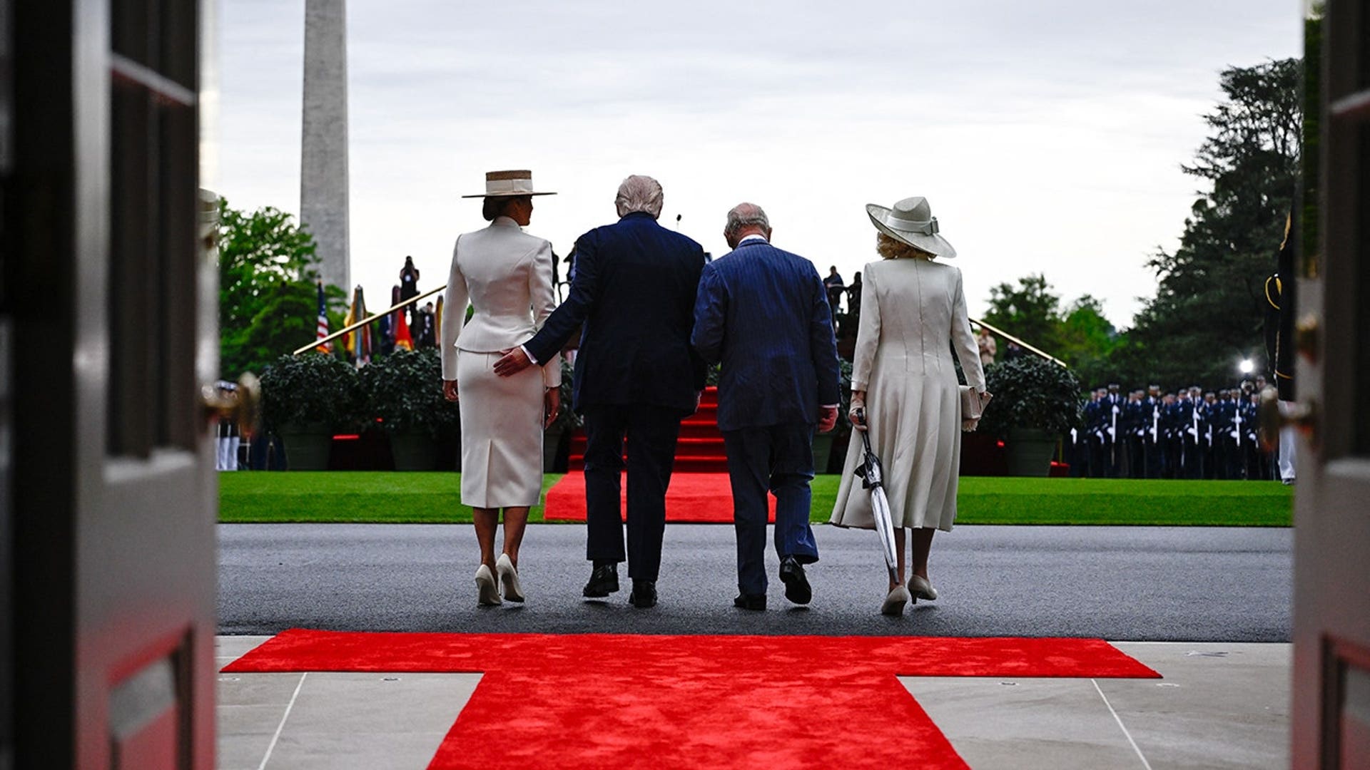 melania-trump-charle-camilla-behi8nd.jpg