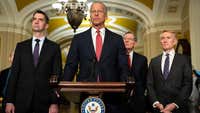 Senate Republicans pause immigration bill push after a tense closed-door meeting over the Trump administration's surprise anti-weaponization fund.