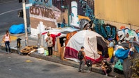 DOJ charges California woman for allegedly bribing homeless people on Skid Row to sign petitions in what officials call an election-integrity racket.