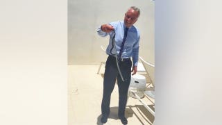 RFK Jr barehands a pair of snakes on Dr. Oz's patio in wild video