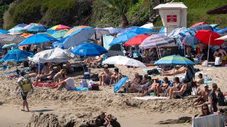 Vacation hot spot cracks down on beach setups with $500 fines for sun shades, canopies